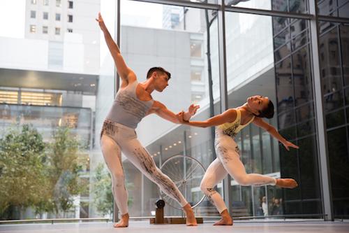 Two dancers pose during their dance of modern art